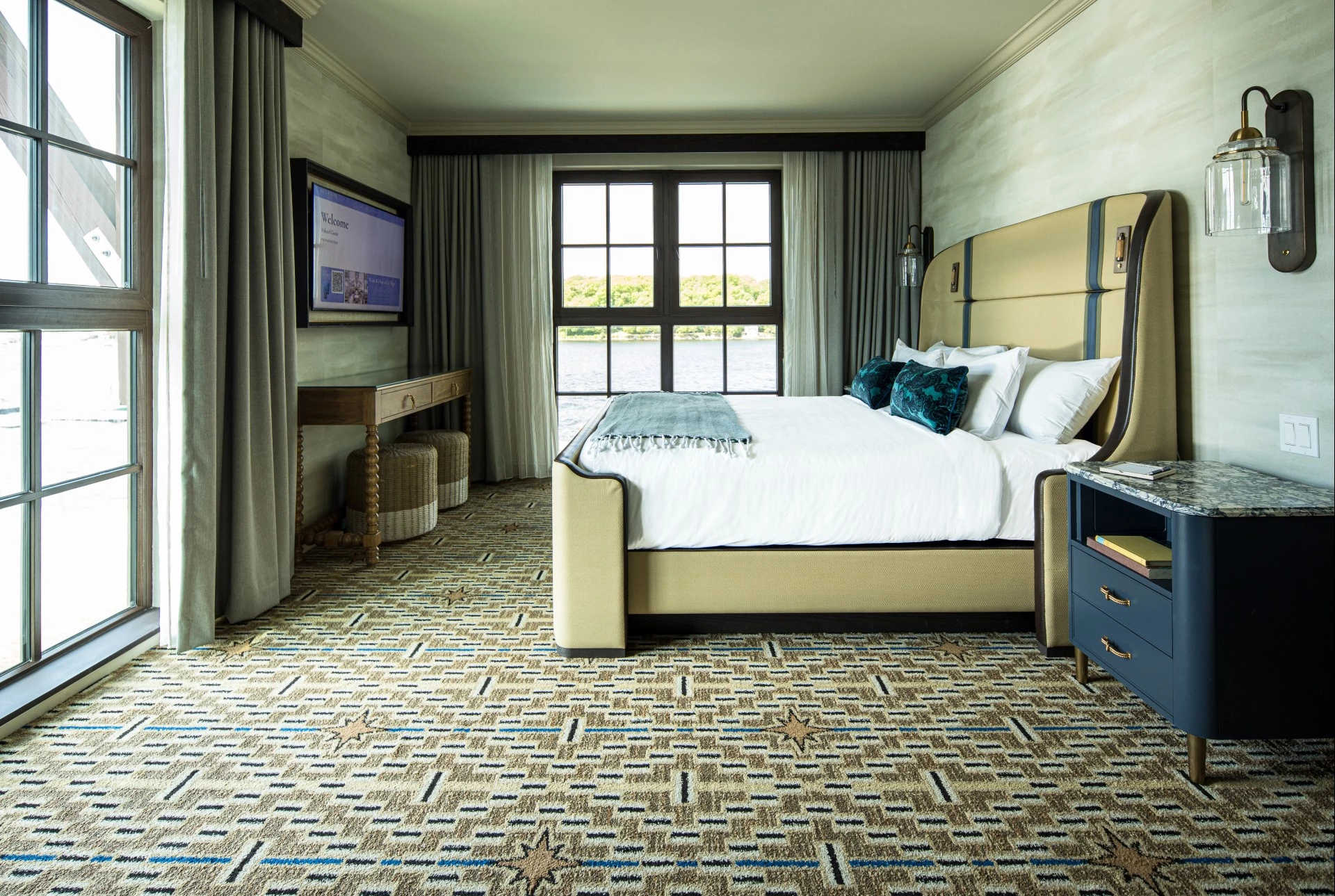 a bedroom with a bed and a television