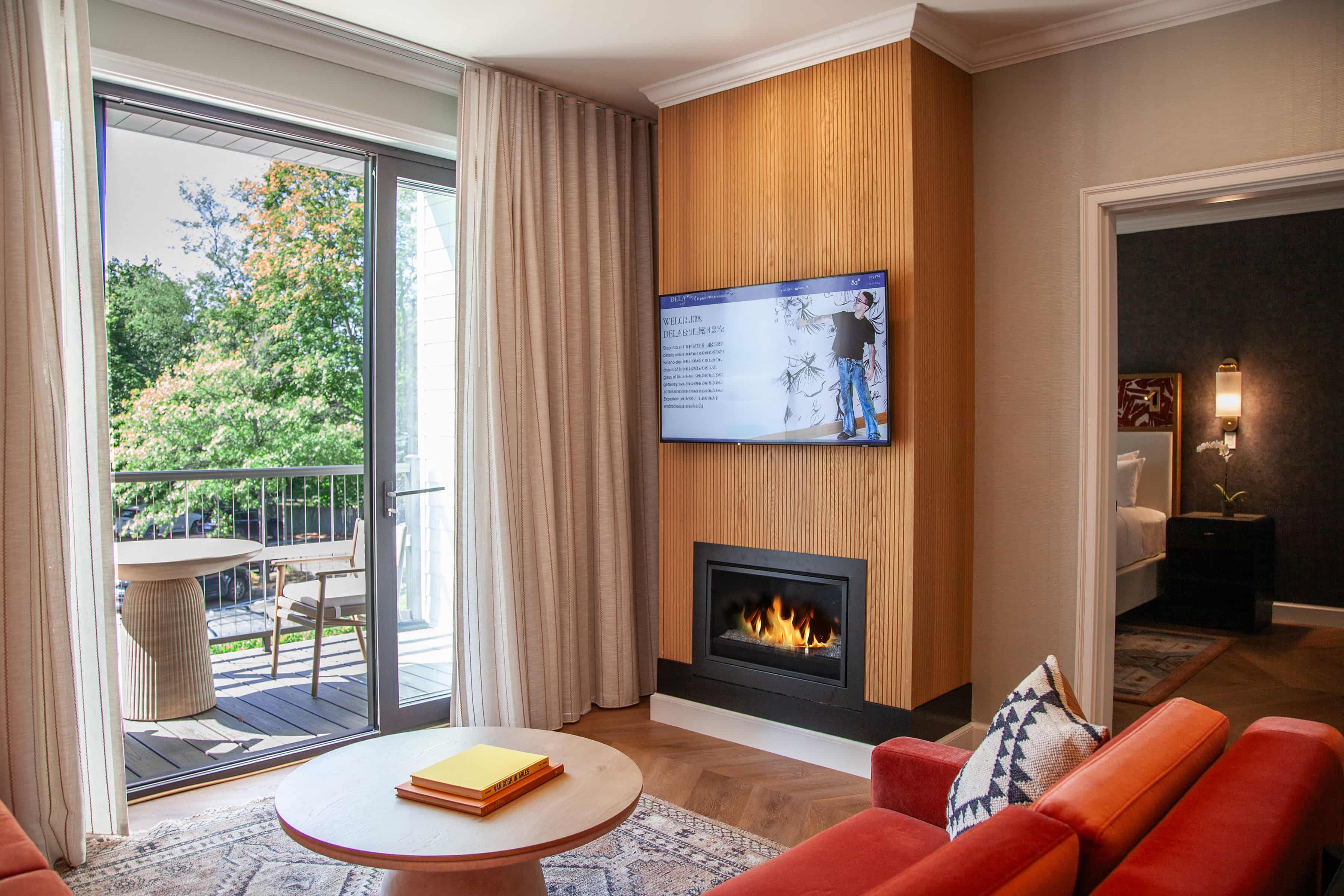 a living room with a fireplace and a television