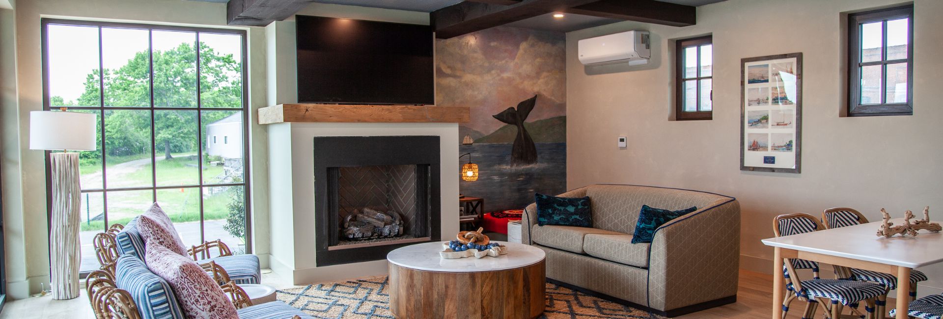 a living room with a fireplace and couch
