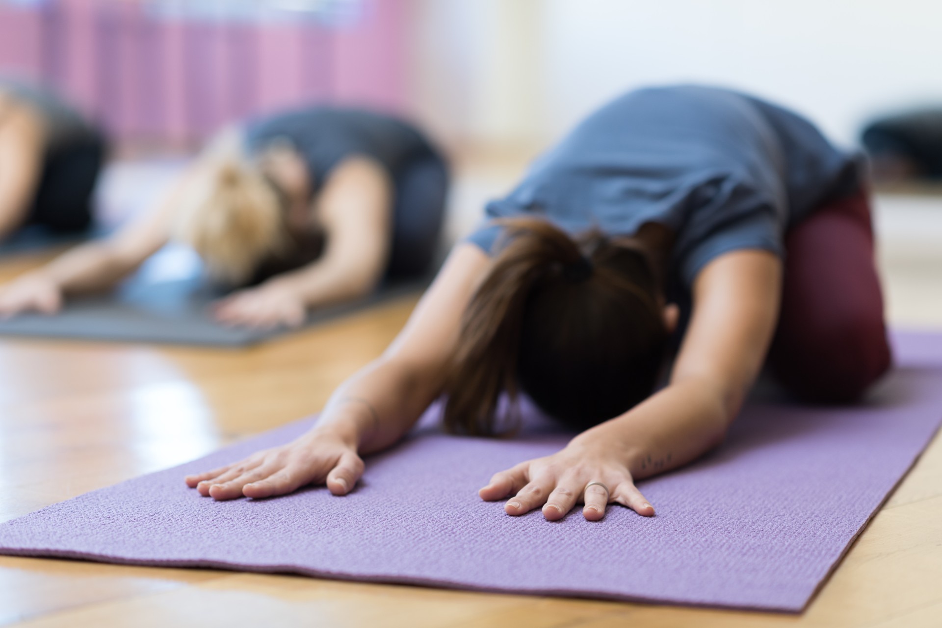 a woman stretching on a mat
