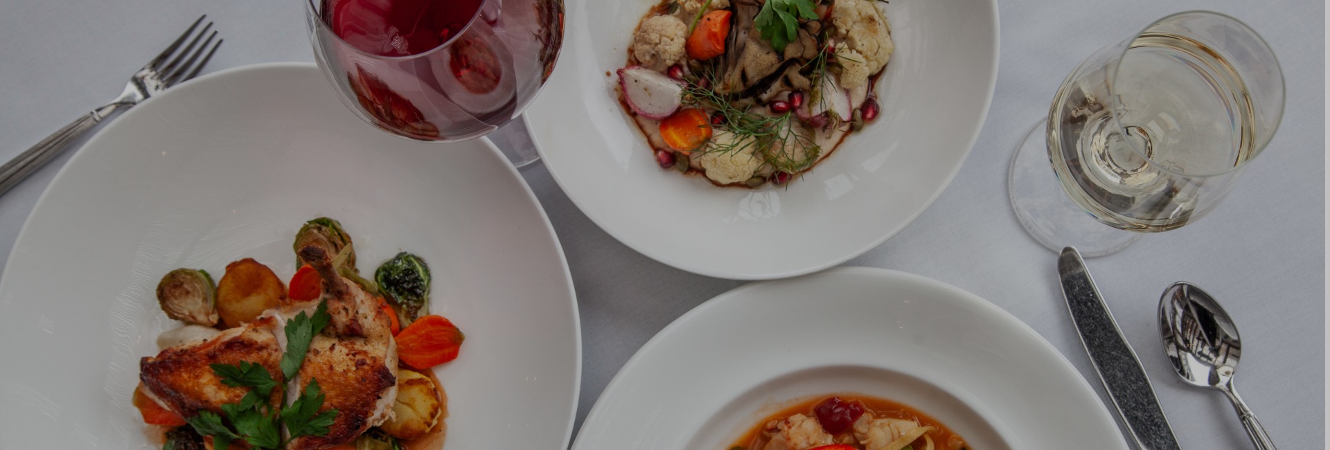 a plate of food and a glass of wine