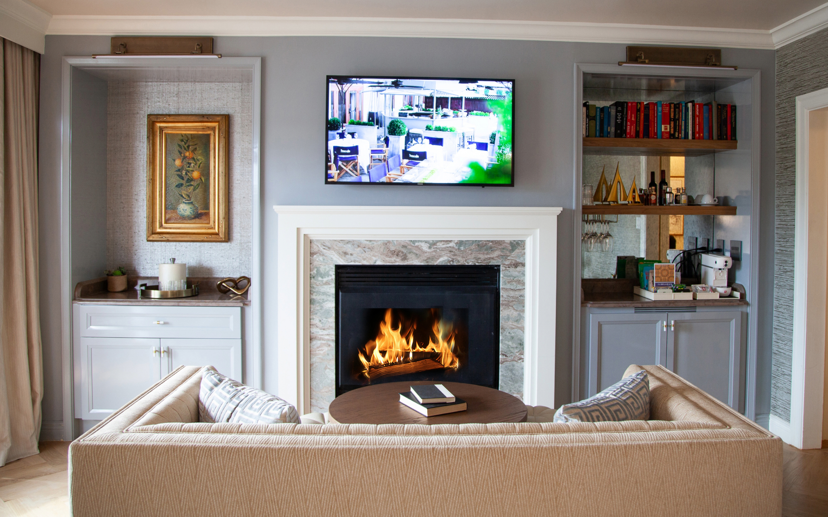 a fireplace with a tv on the wall
