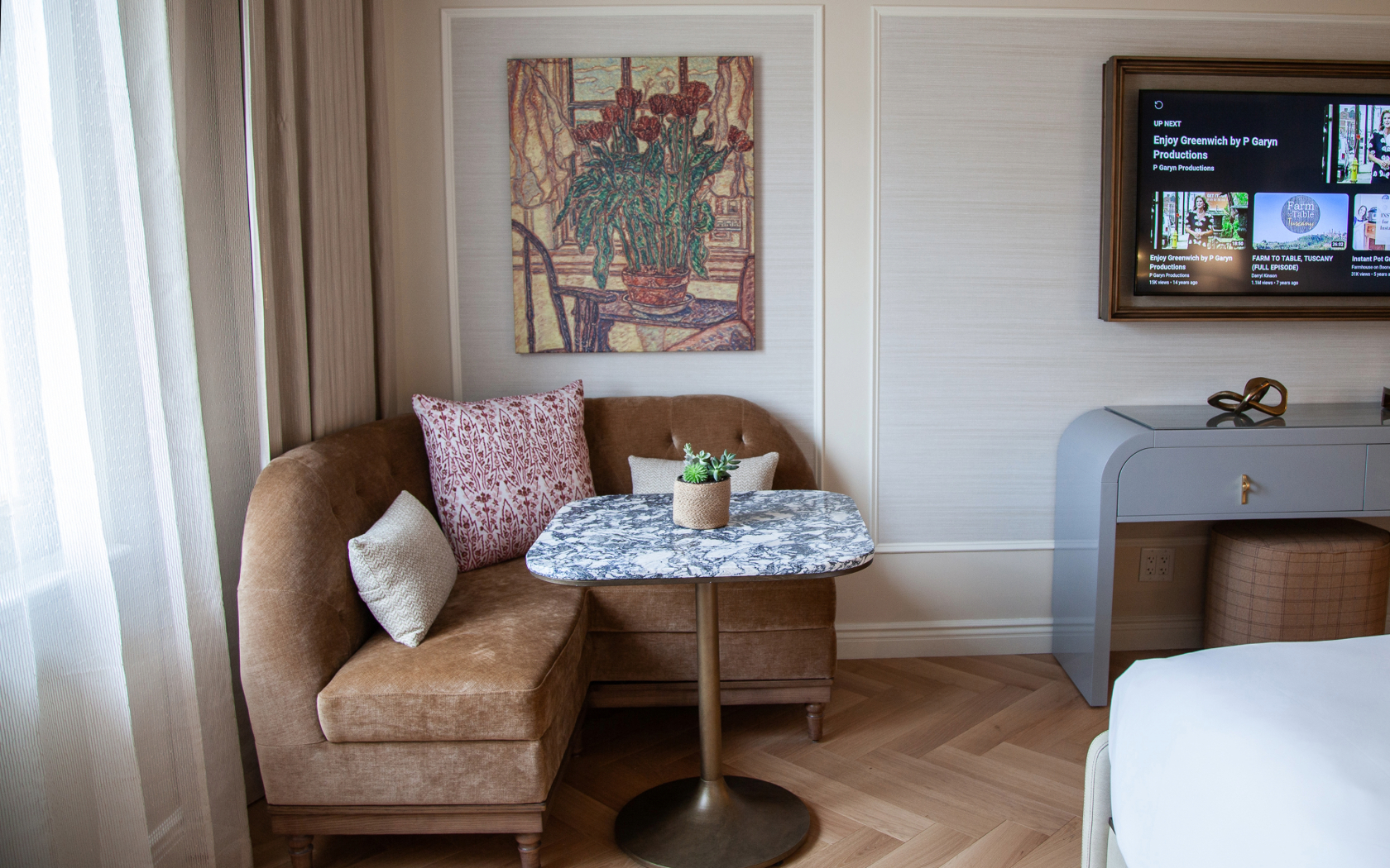 a couch with a table and pillows