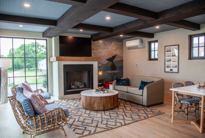 a living room with a fireplace and couches