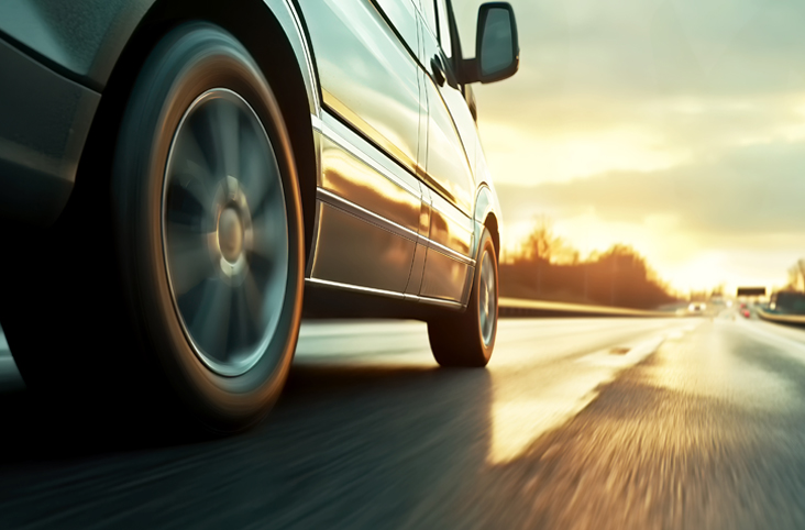 a close-up of a van on a road