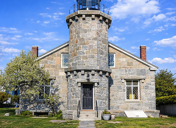 a stone building with a lighthouse