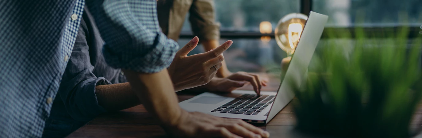 Two people on a laptop