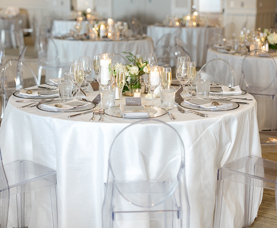 a round table set for a wedding reception
