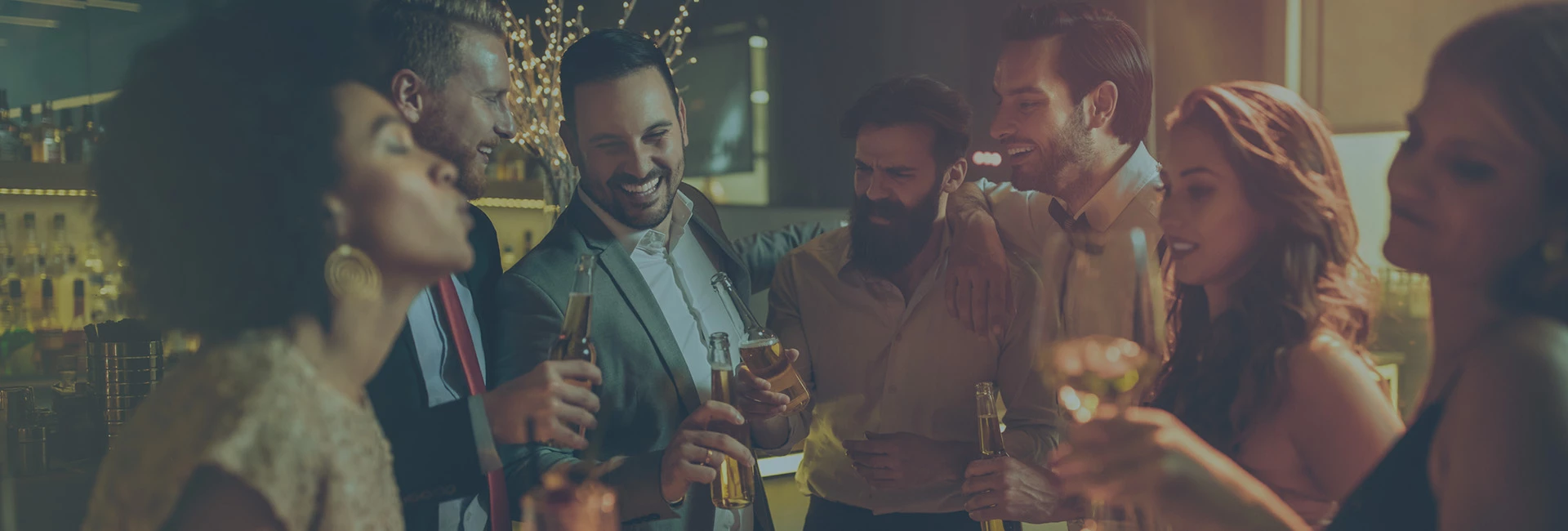 A group of friends holding beers