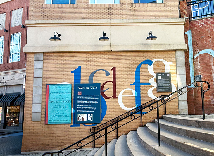a building with stairs and signs