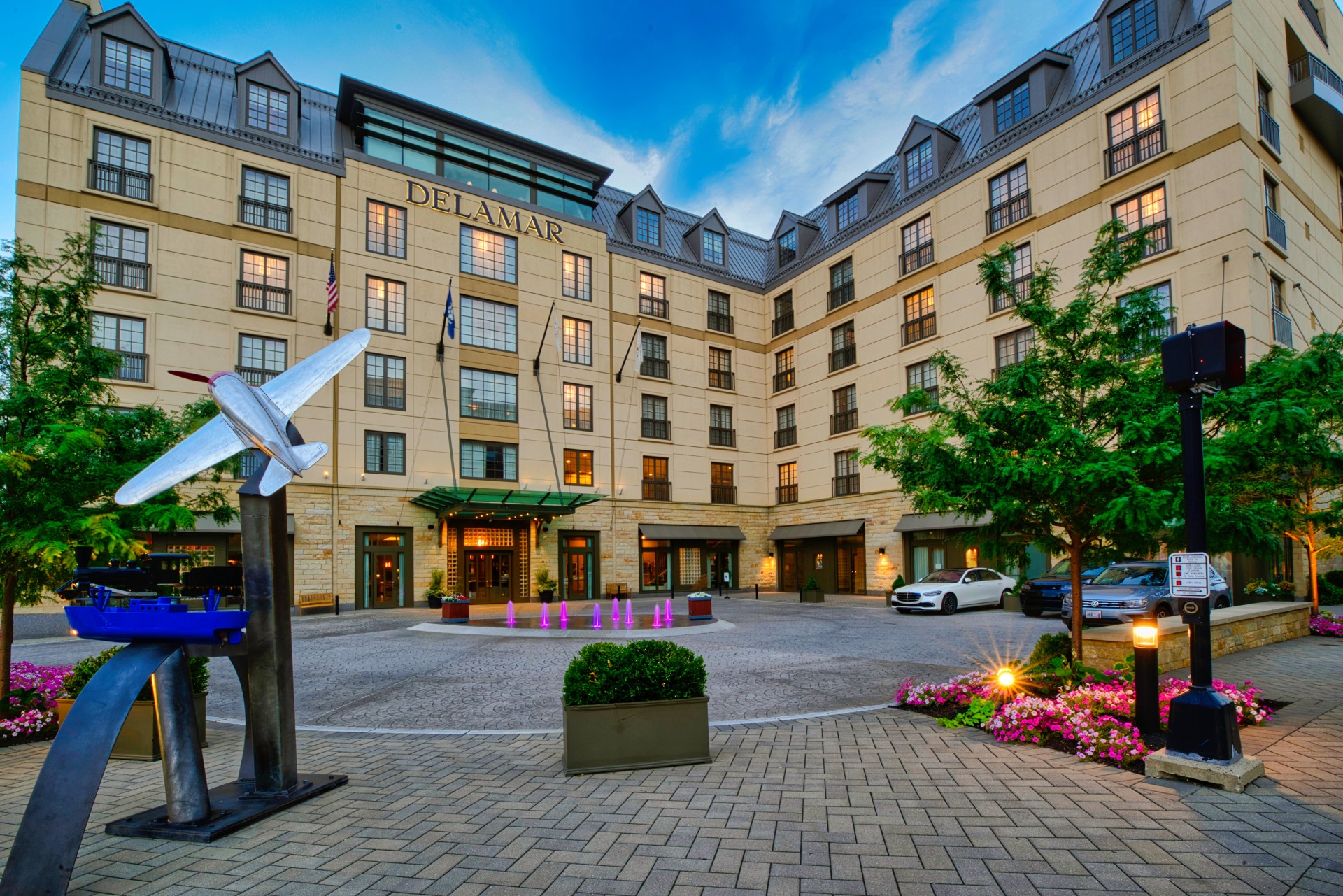 a building with a statue of a plane in front of it