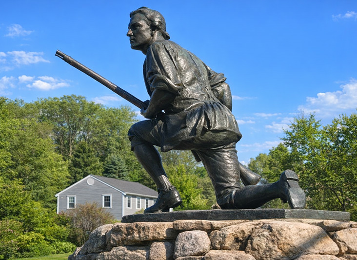 a statue of a man holding a rifle