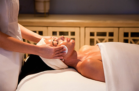 A woman getting a facial treatment
