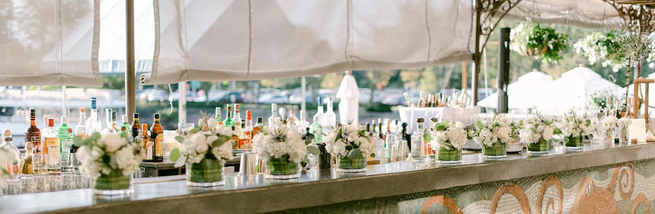 a table with flowers and bottles on it