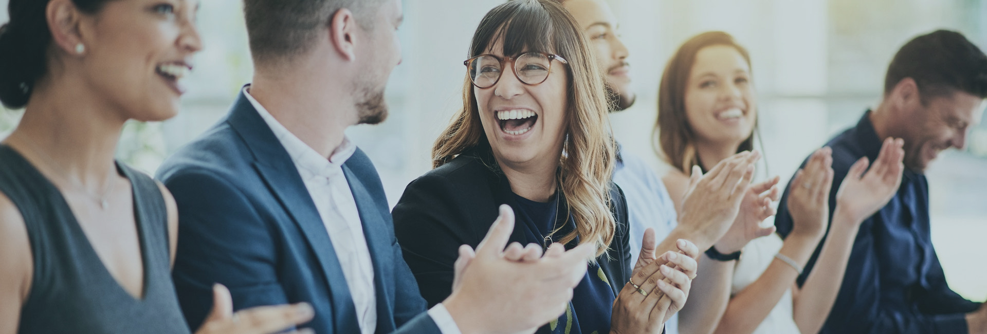 a group of people clapping