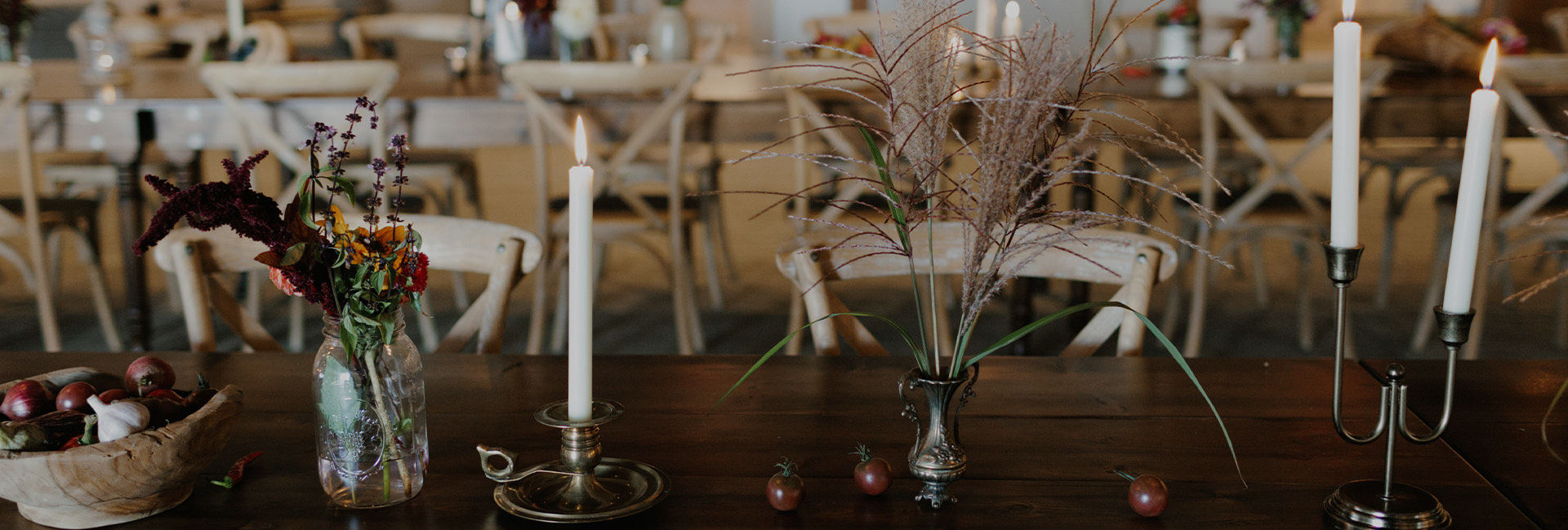 a table with candles and flowers