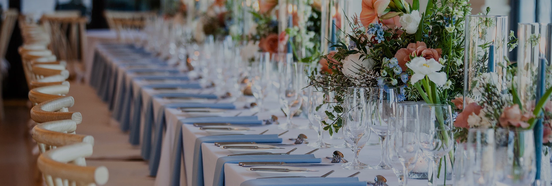 a table with glasses and utensils