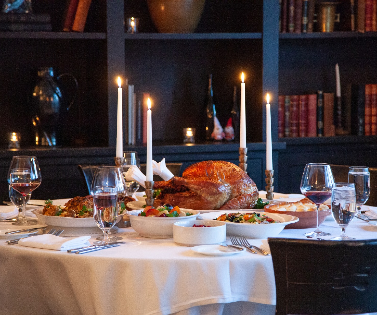 a table with food and wine glasses on it