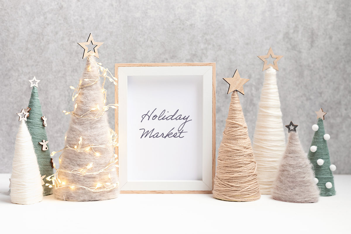 a group of trees with string lights and a frame