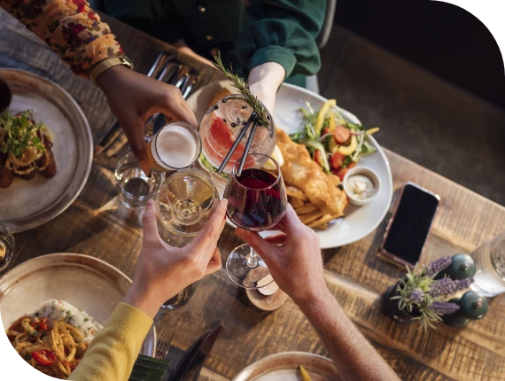 a group of people holding glasses of wine