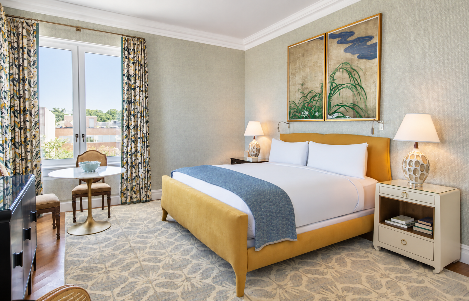 a bedroom with a bed and a table