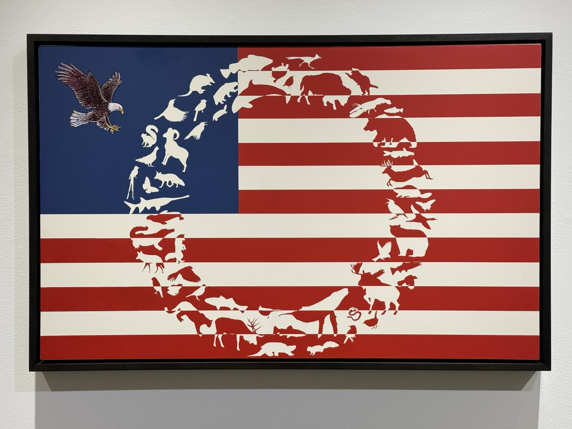 a flag with an eagle flying in the center