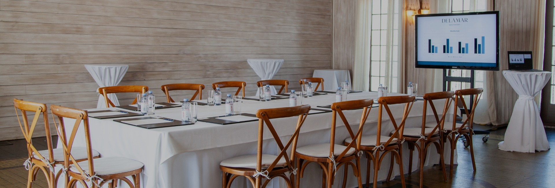 a table with chairs and water bottles