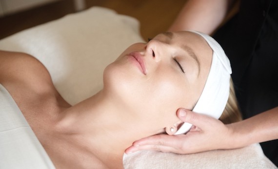 a woman with her eyes closed getting a massage
