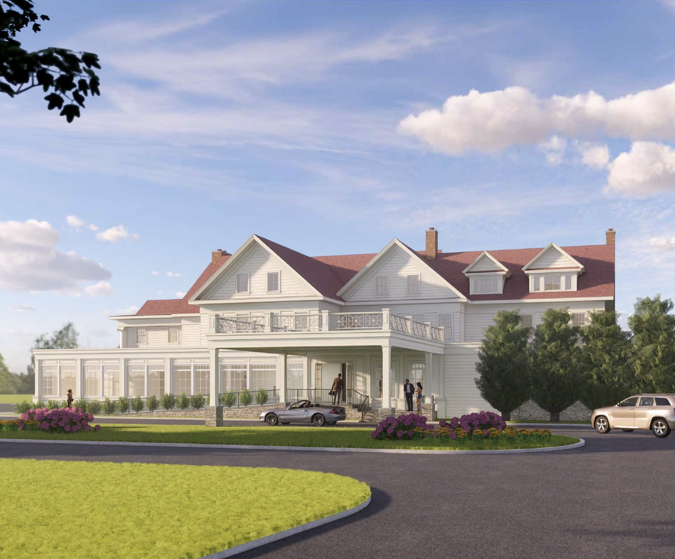 a large white house with a lawn and cars