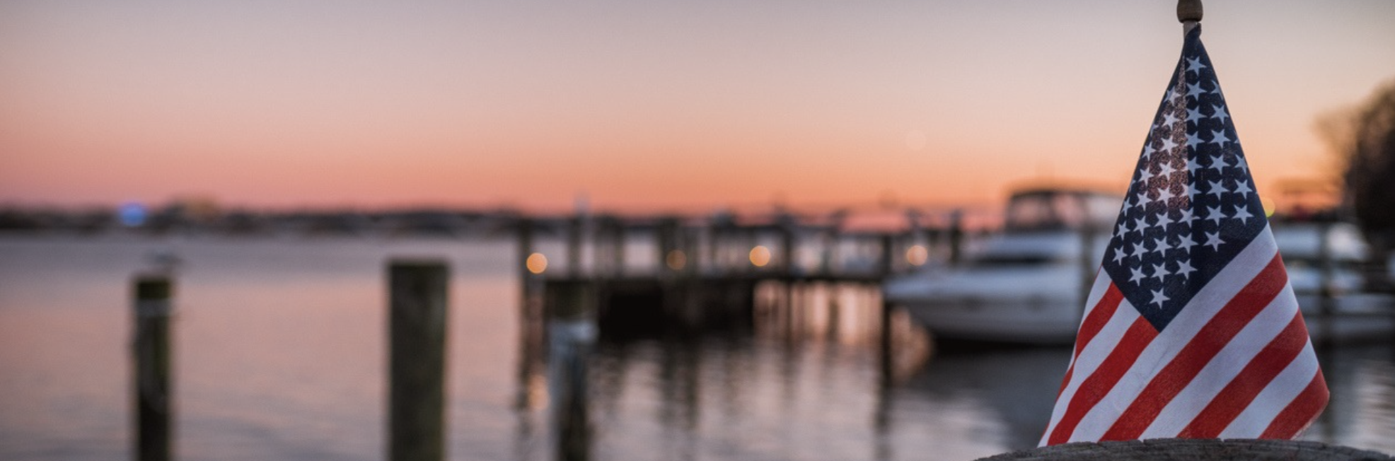 a blurry image of a dock in the water
