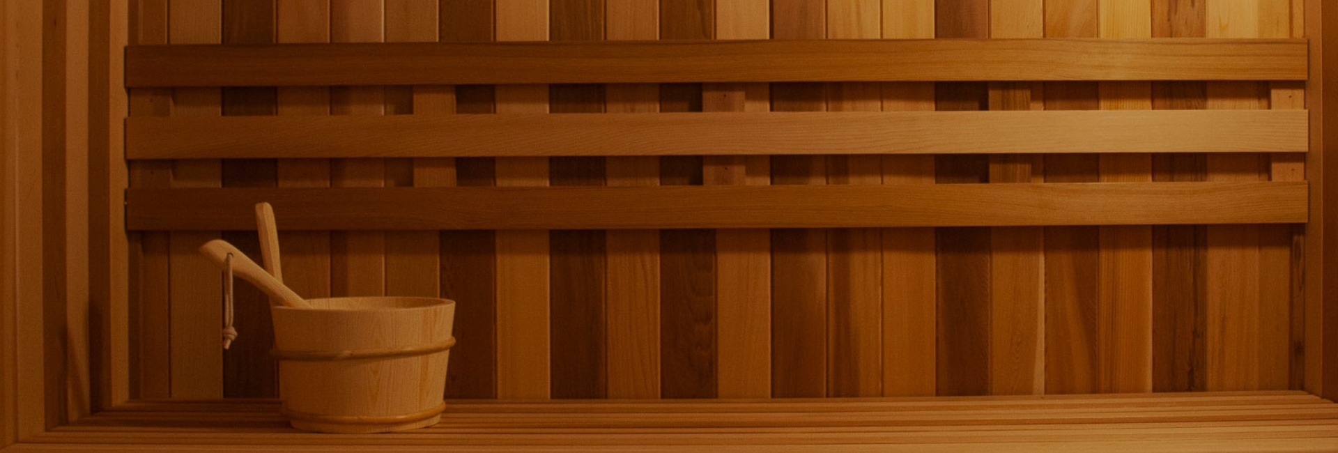 a wooden bench with a bucket on it