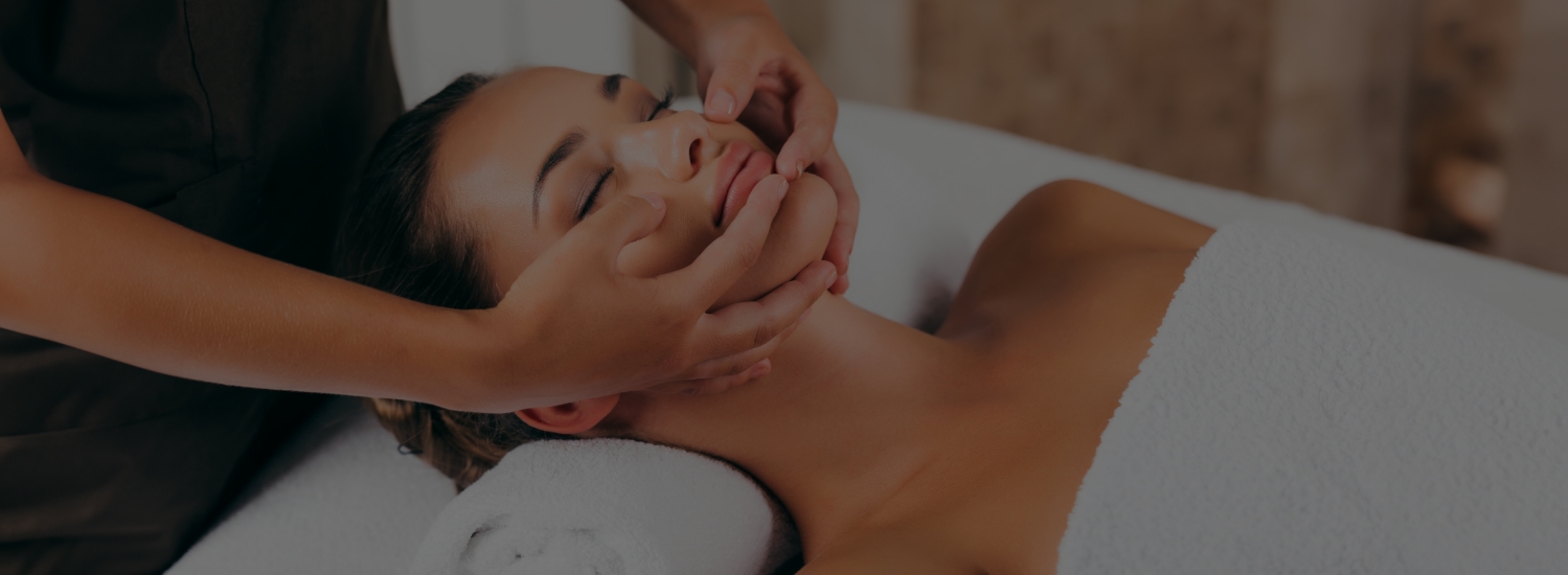 a woman receiving a face massage