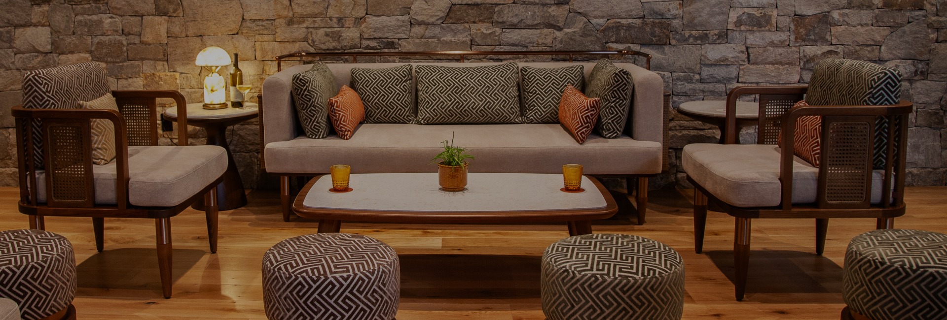 a couch with pillows and a coffee table