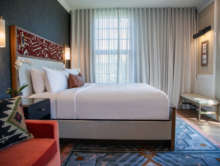 a bedroom with a bed and a chair