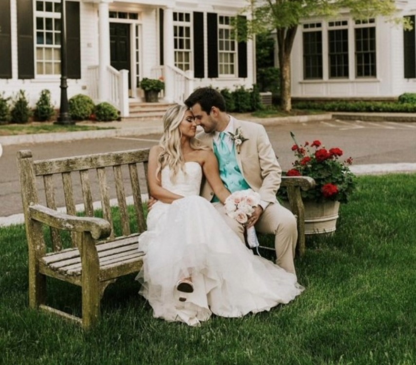 a man and woman sitting on a bench