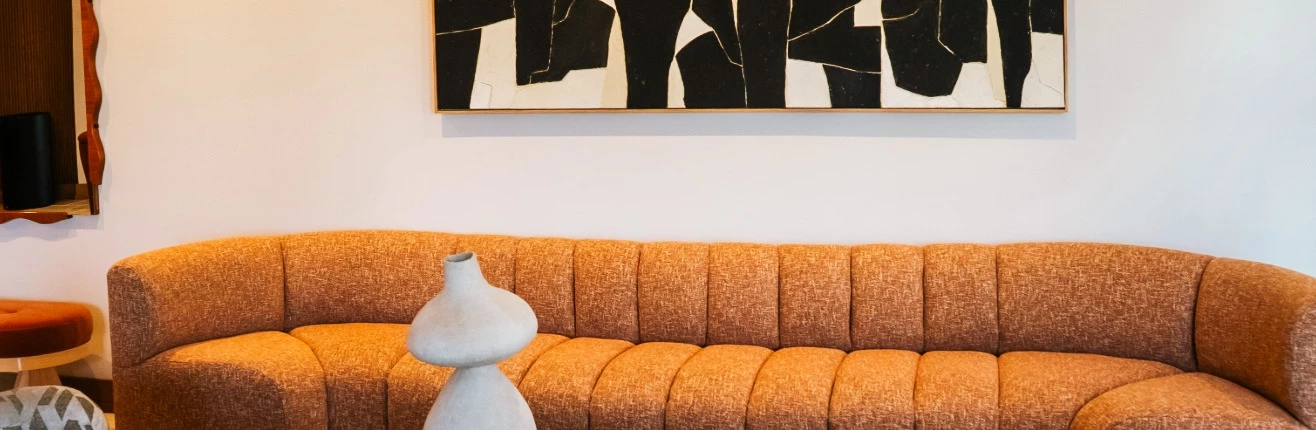 a white lamp next to a couch