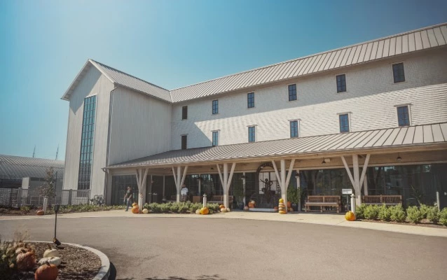 a large white building with pumpkins