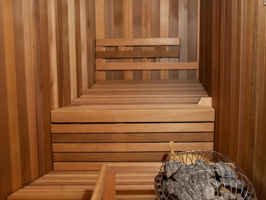 a sauna with a basket of rocks