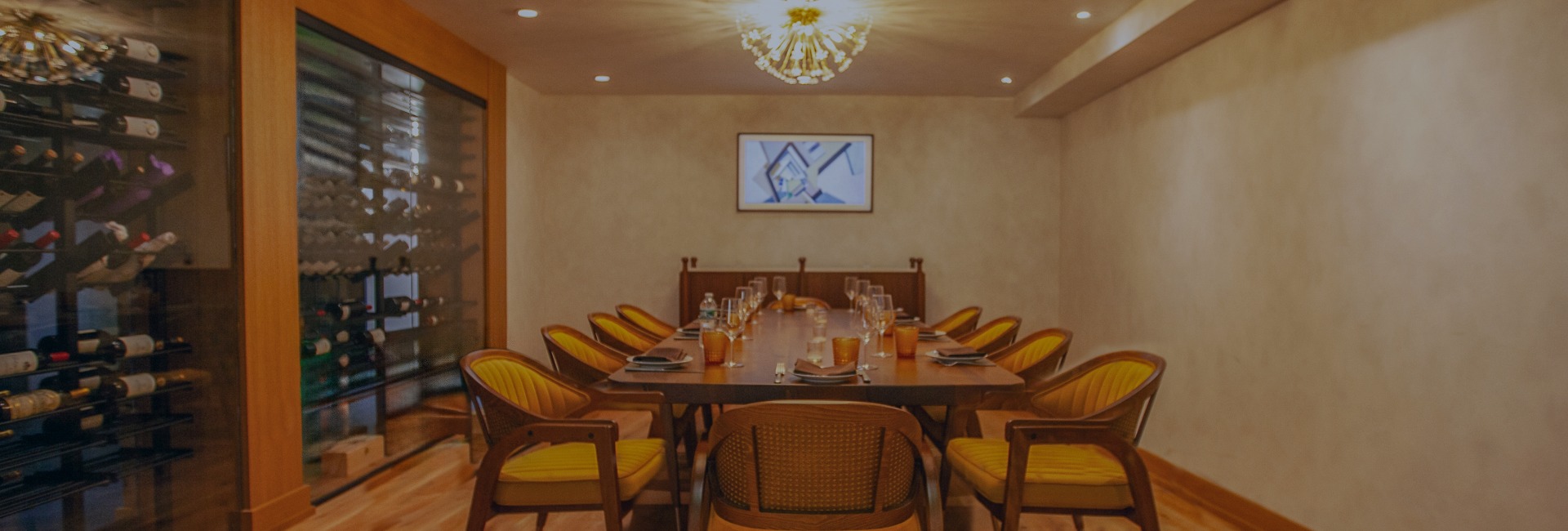 a table with chairs and a chandelier