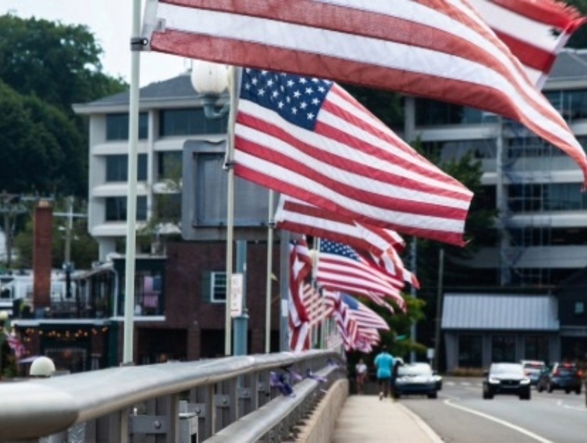 several american flags on a street
