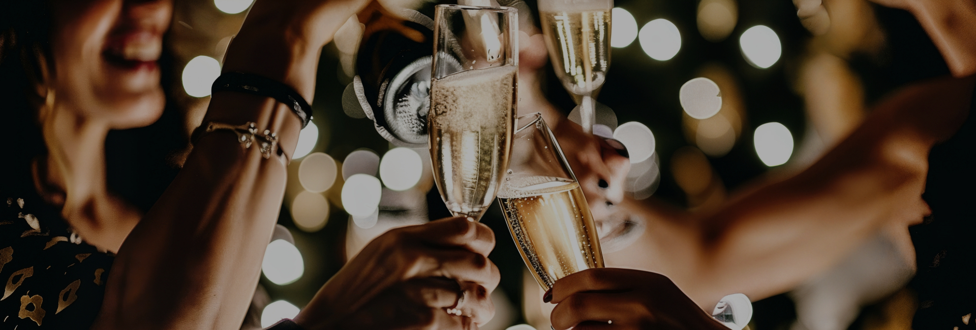 a group of people holding champagne glasses