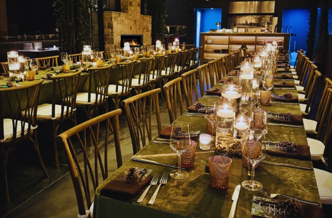 a long table with candles and glasses
