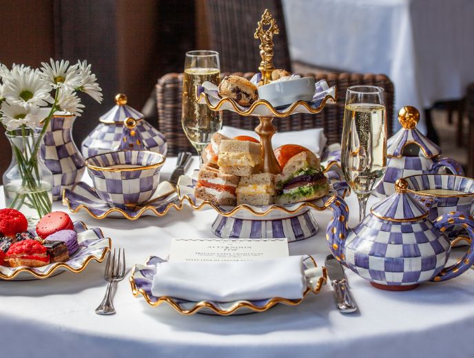 a table with tea set and teapots