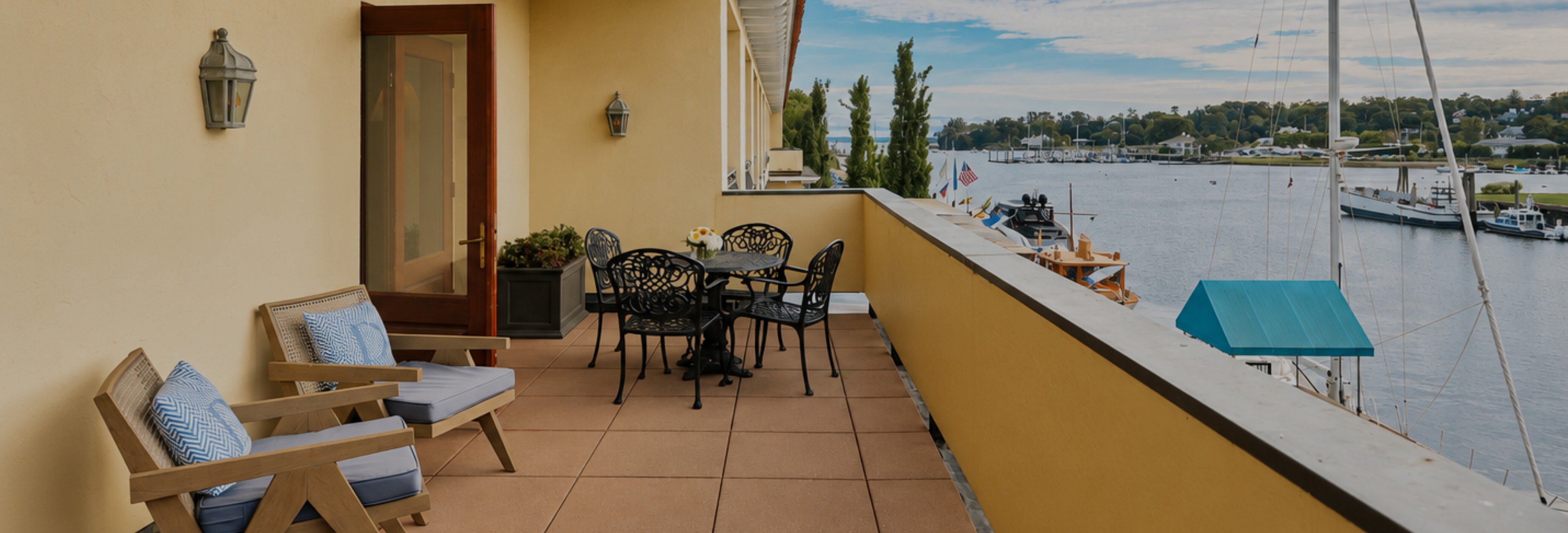 a table and chairs on a balcony