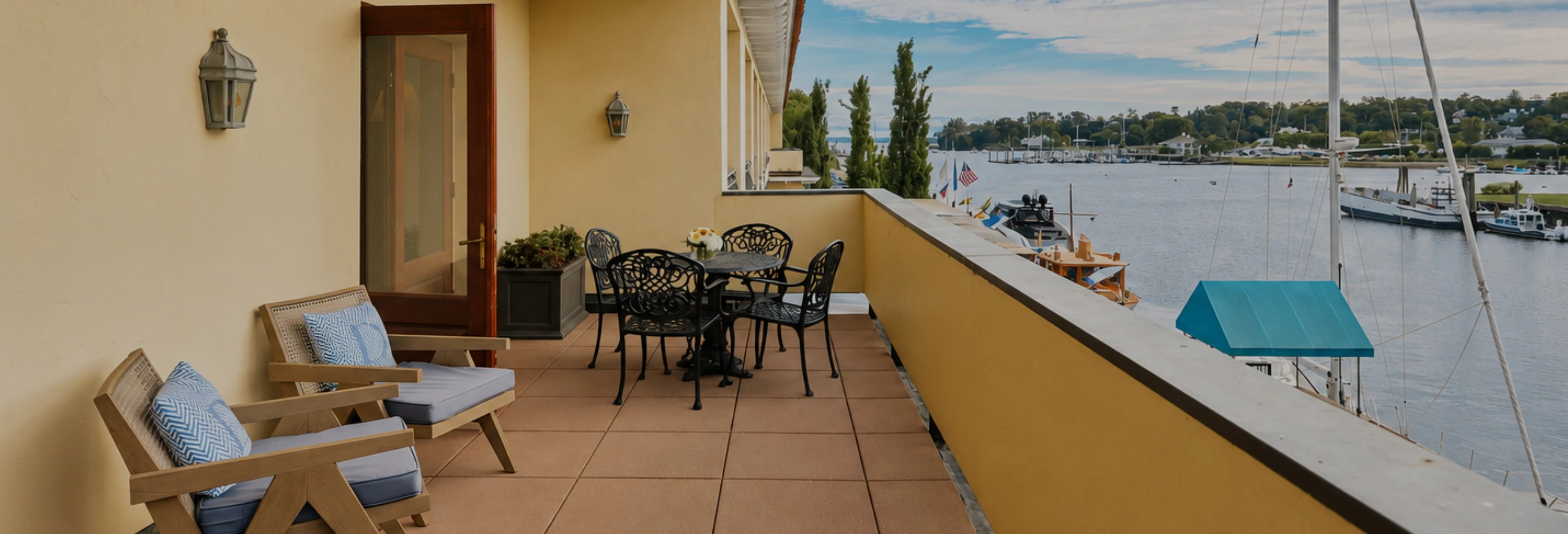 a table and chairs on a balcony