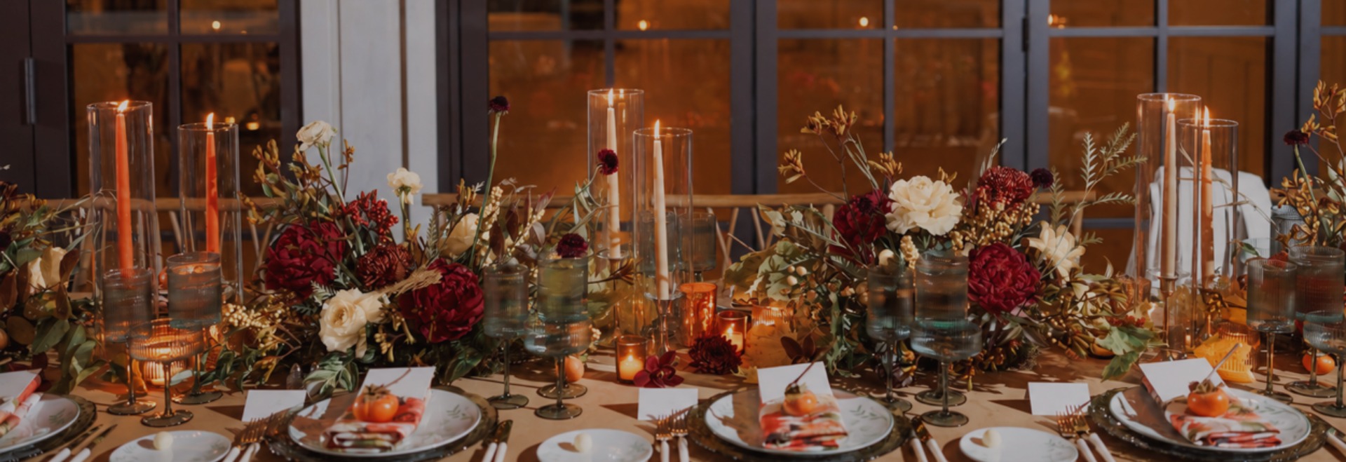 a table with flowers and candles