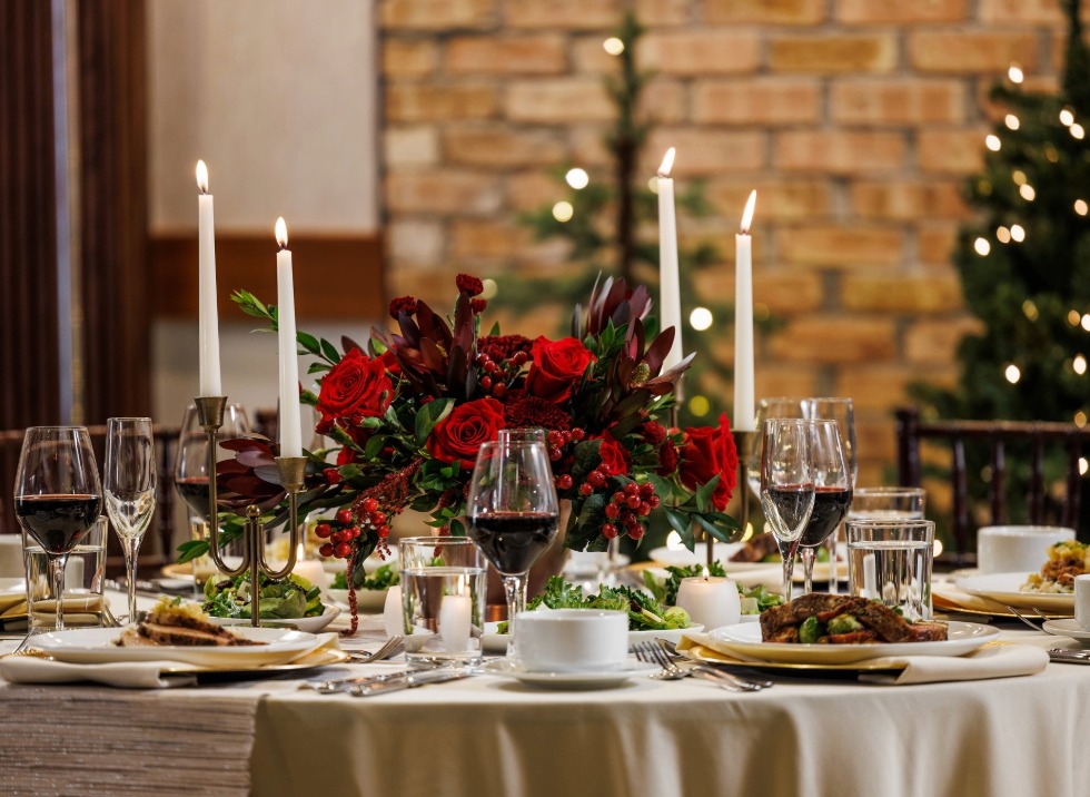 a table with a bouquet of flowers and candles