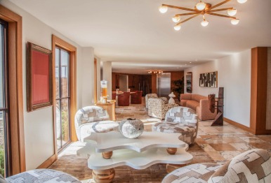 a living room with a couch and chairs