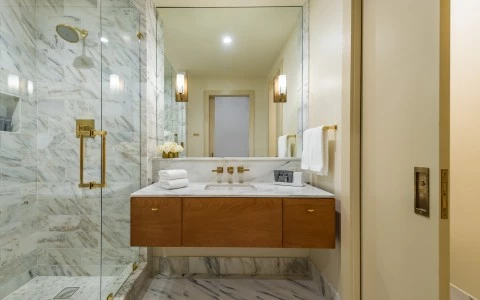 King bathroom with vanity & marble shower
