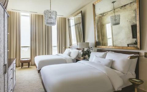 a bedroom with a large mirror